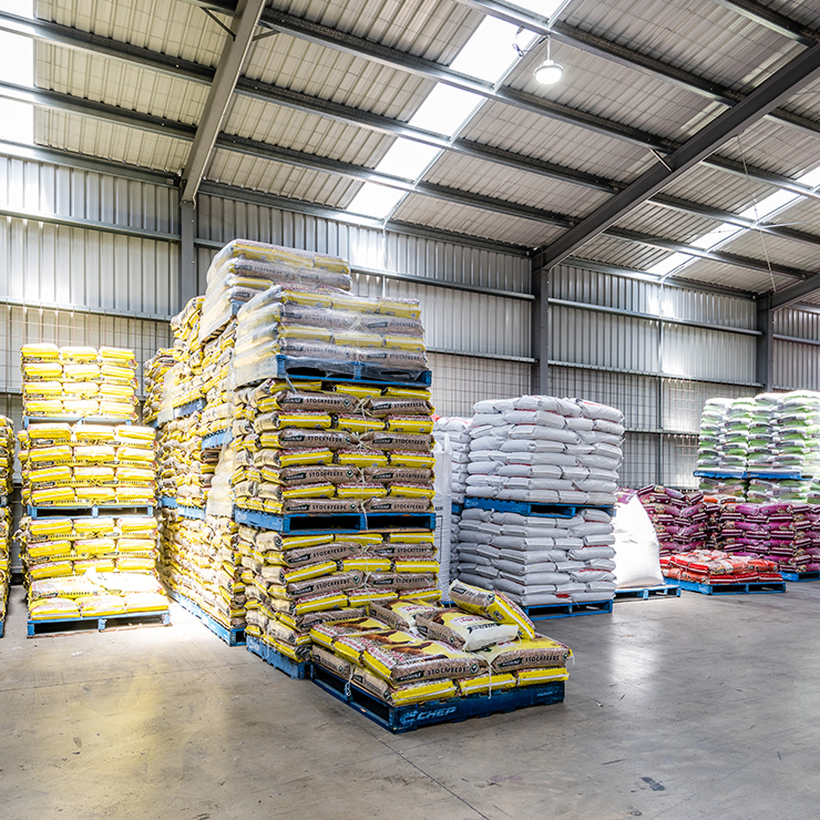 Pallets of Riverina Stockfeeds bagged products in the Riverina Casino branch 